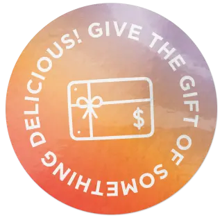 Round sticker with gift card icon and text "Give the gift if something delicious!"