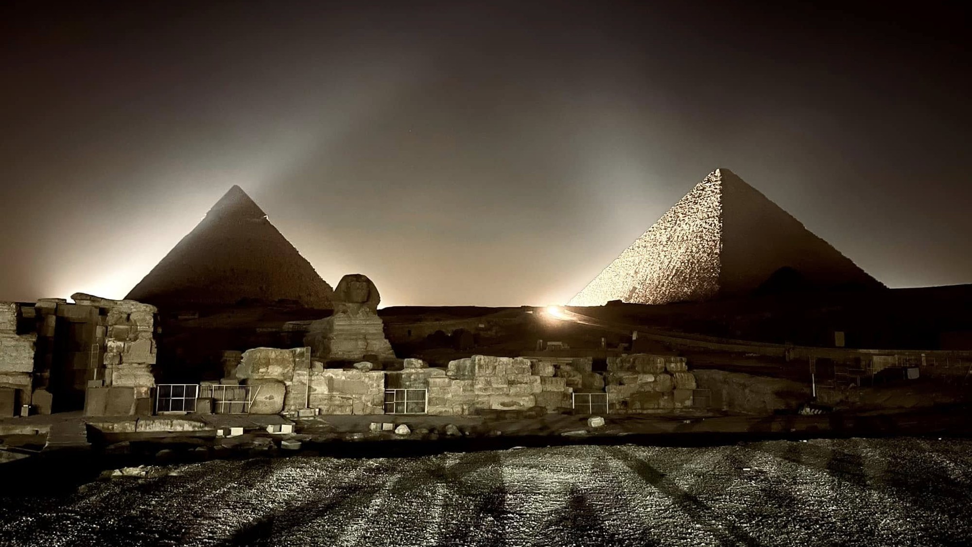 The Giza pyramids and the Sphinx lit up at night for the light show