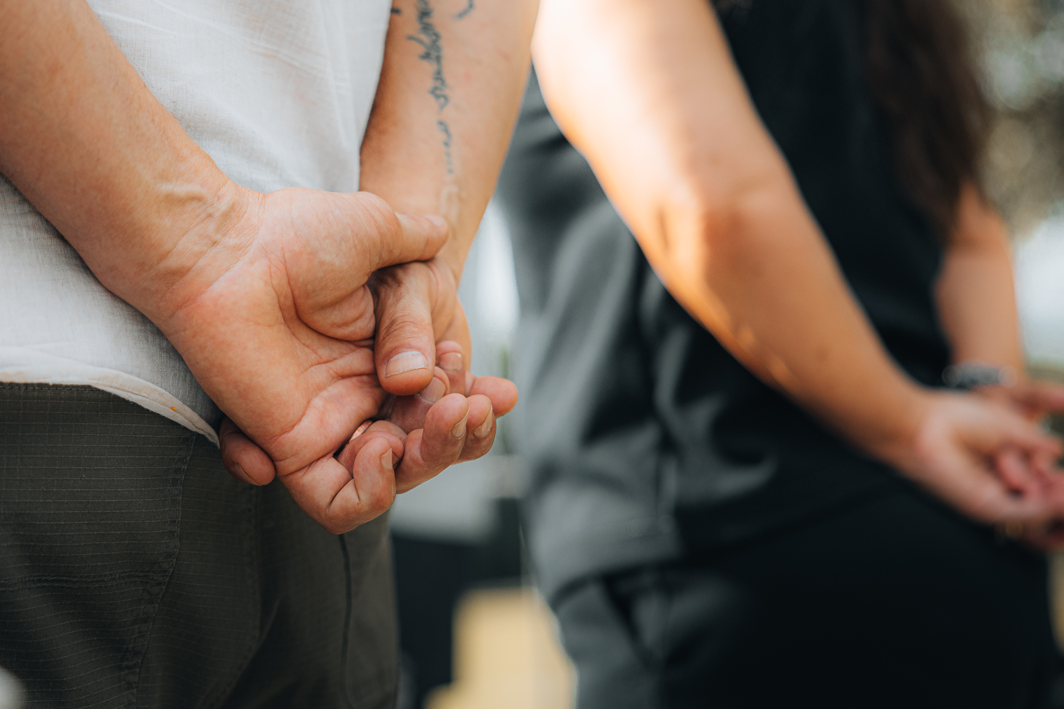 Close-up of two people holding hands