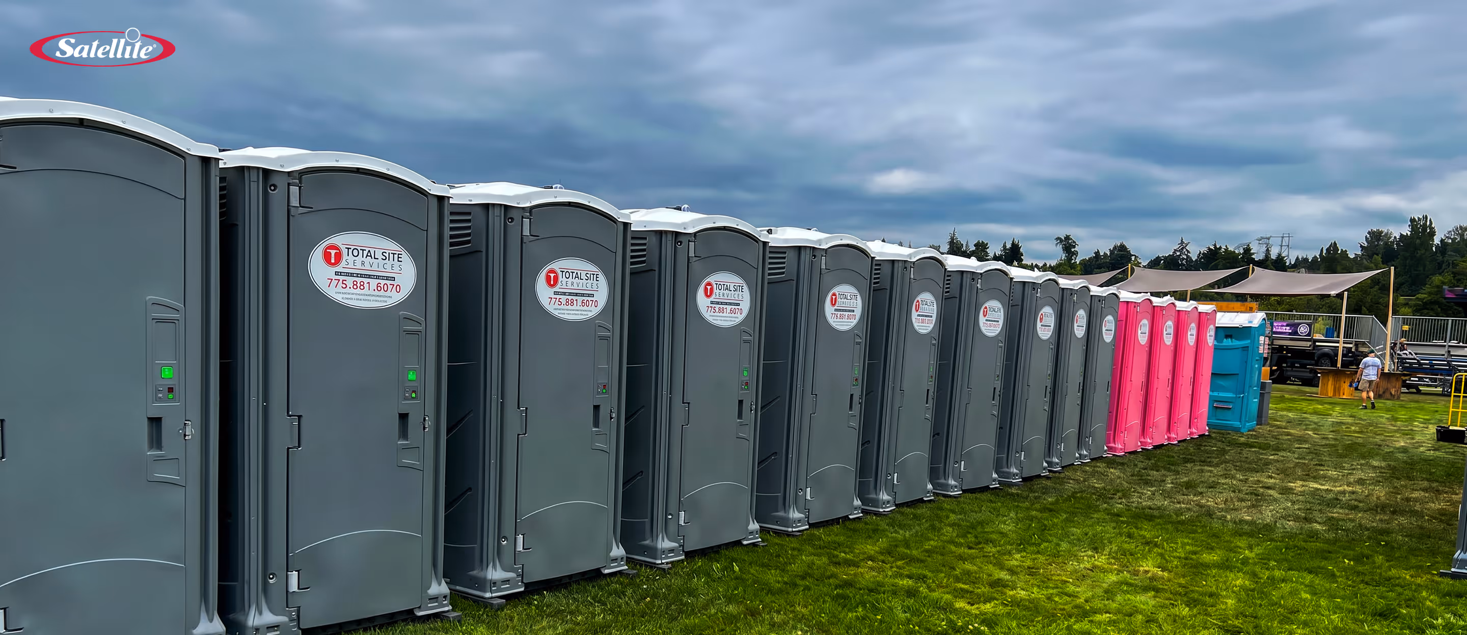 Portable restroom units from Total Site Services lined up at an outdoor event site, showcasing clean portable sanitation solutions, construction site restroom rentals, and reliable service operations in the Canadian portable sanitation industry.