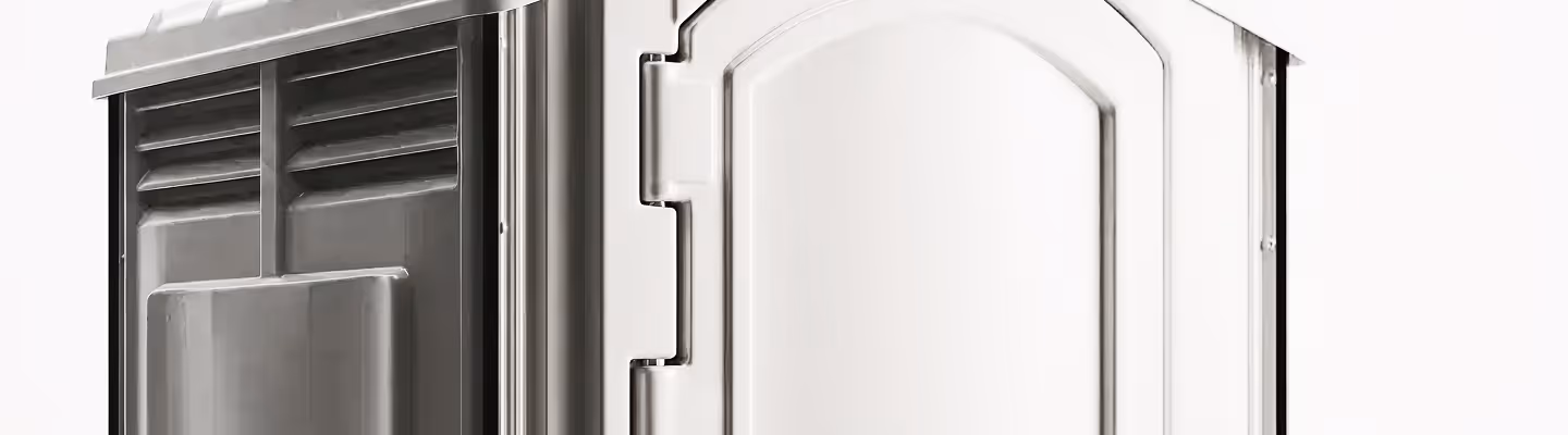 Partial view of white plastic portable restroom door and ventilation panel