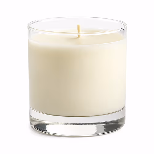 White unscented candle in a clear glass container with an unlit wick.