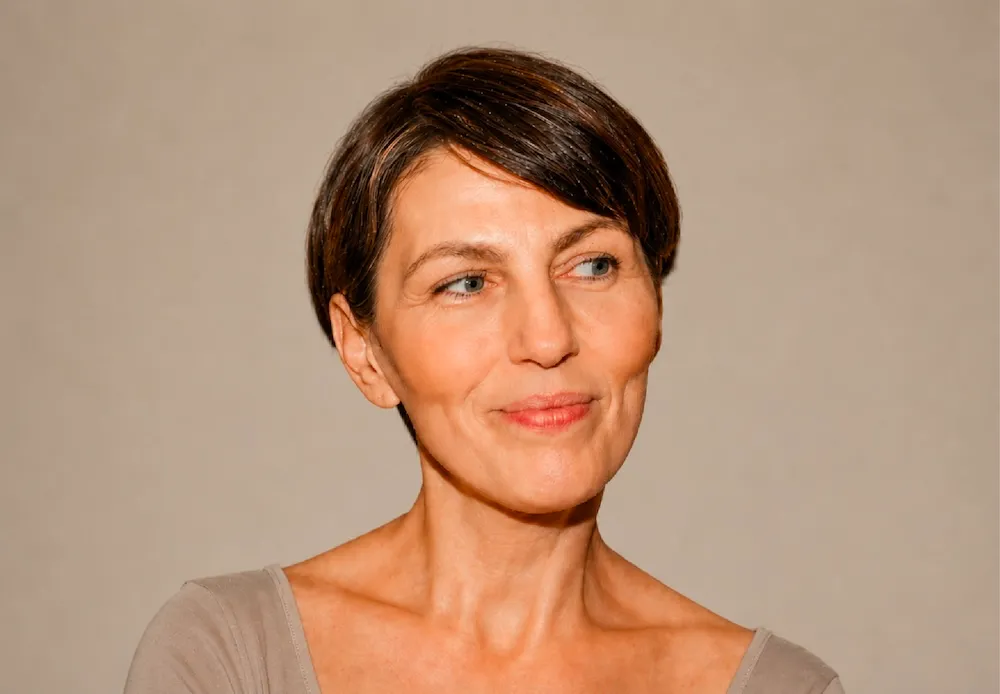 An image of a woman smiling.