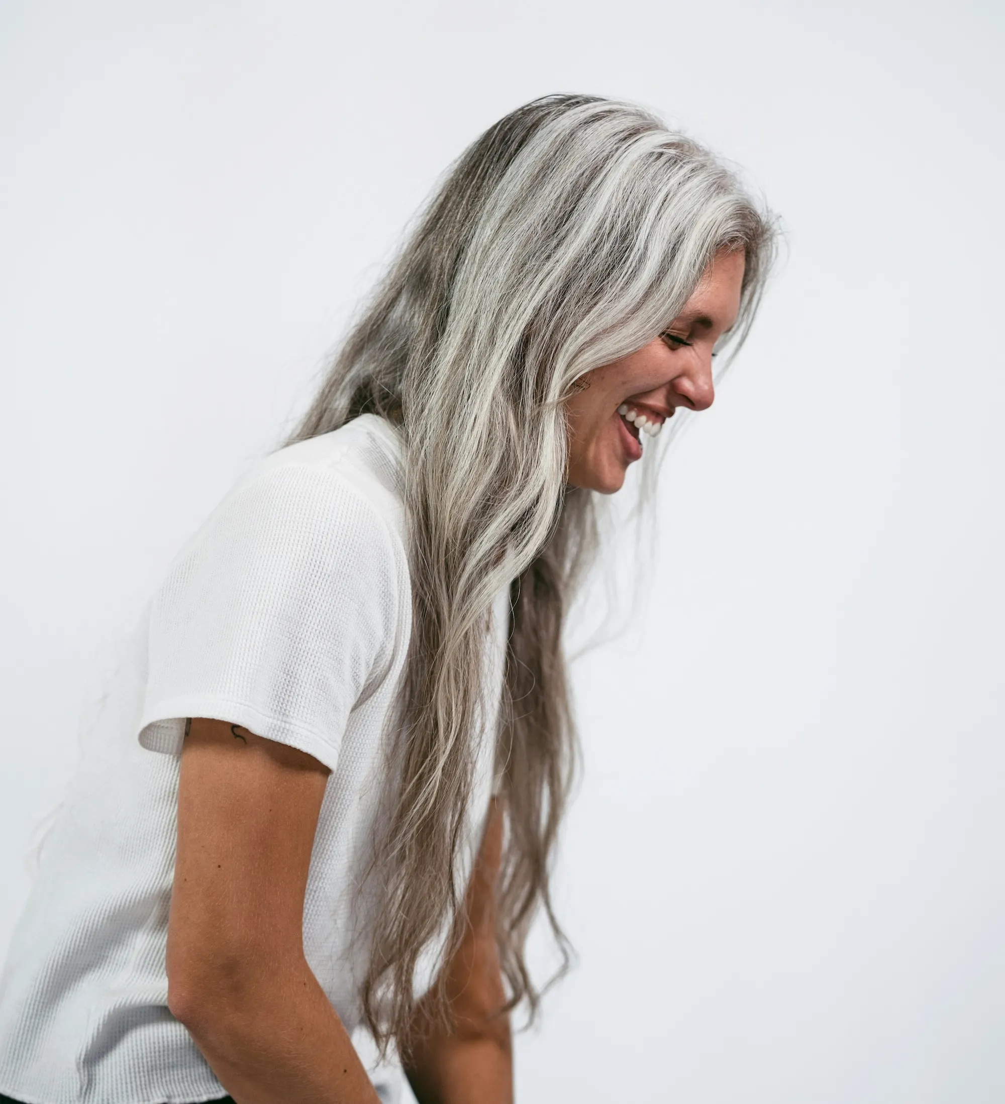 An image of a middle aged woman smiling.