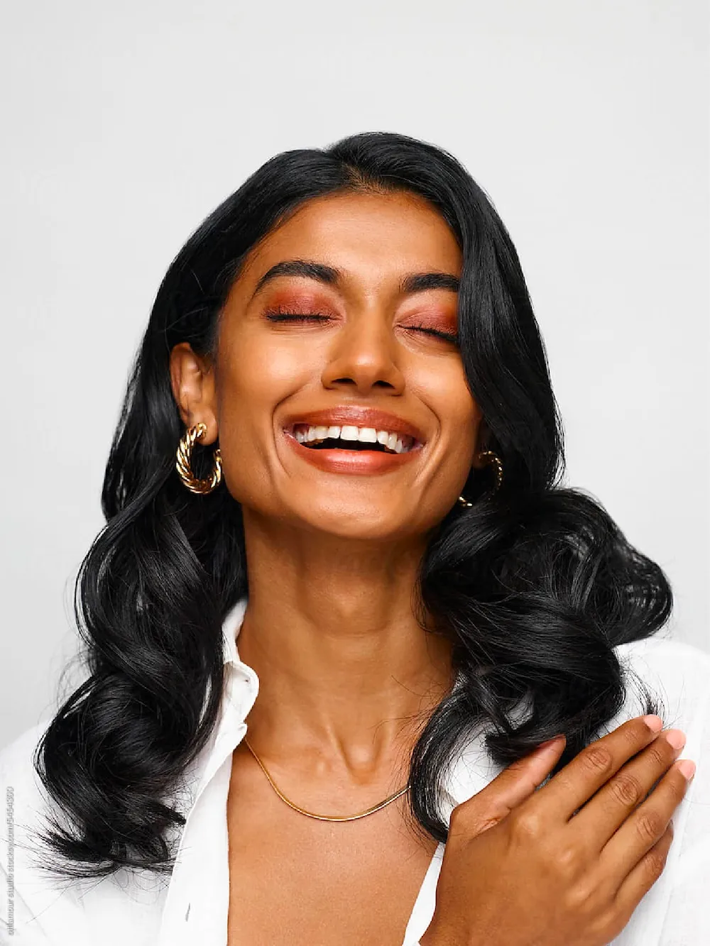 An image of a woman smiling.