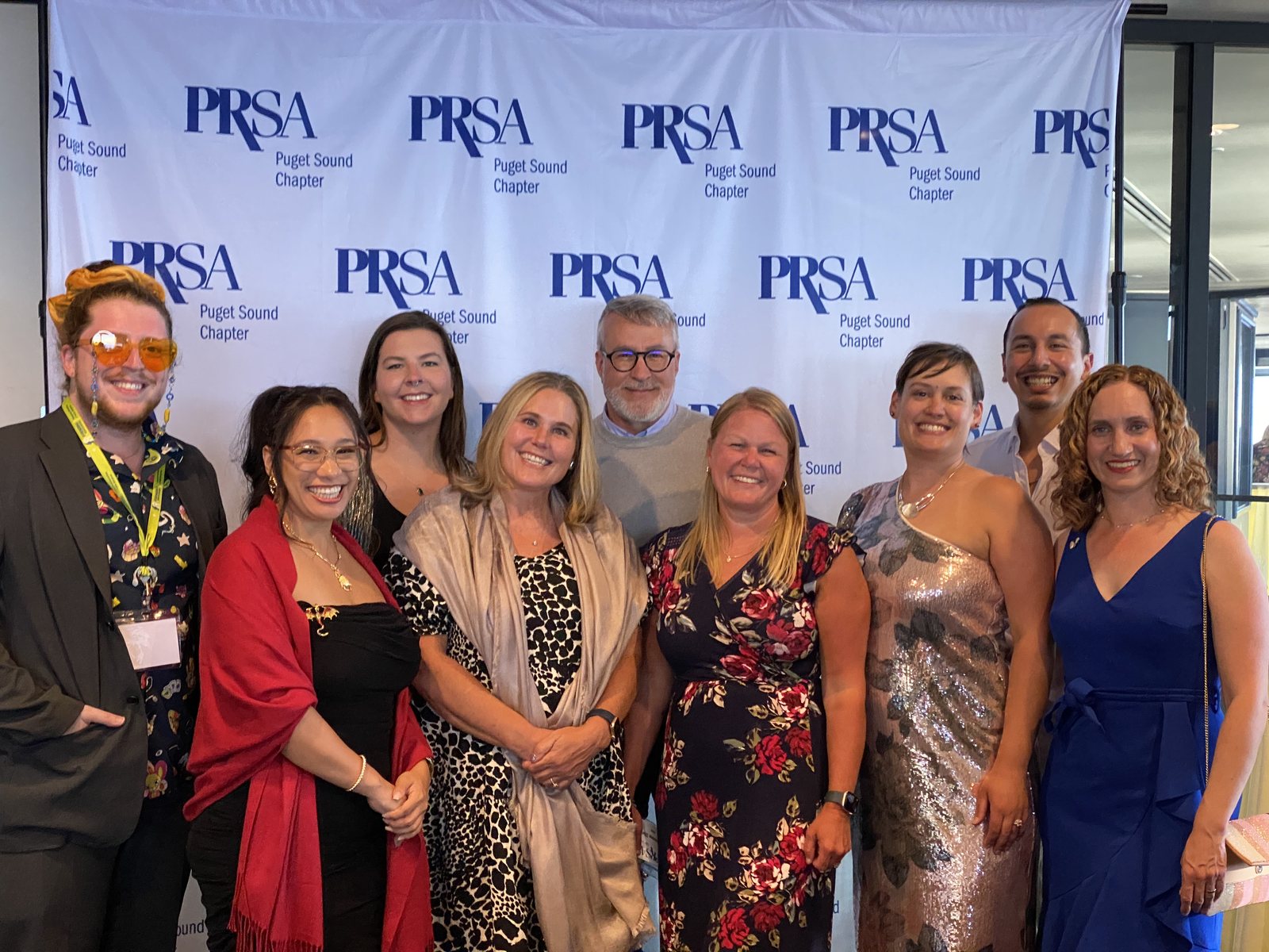 PRR team members gathered in front of the PRSA Puget Sound Chapter backdrop at the Summit Awards ceremony.