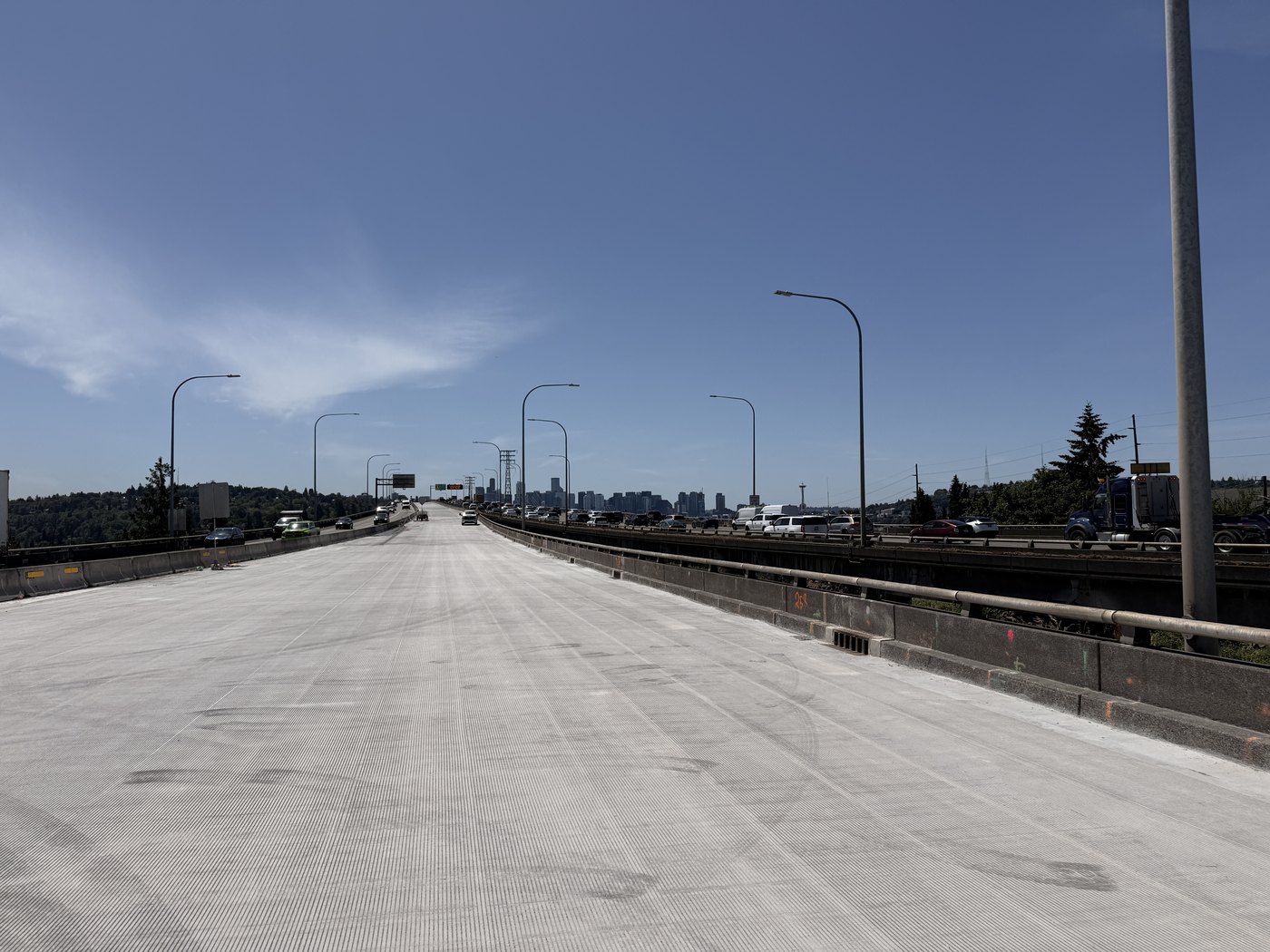 The newly resurfaced upper deck of the Ship Canal Bridge with the Seattle skyline in the distance