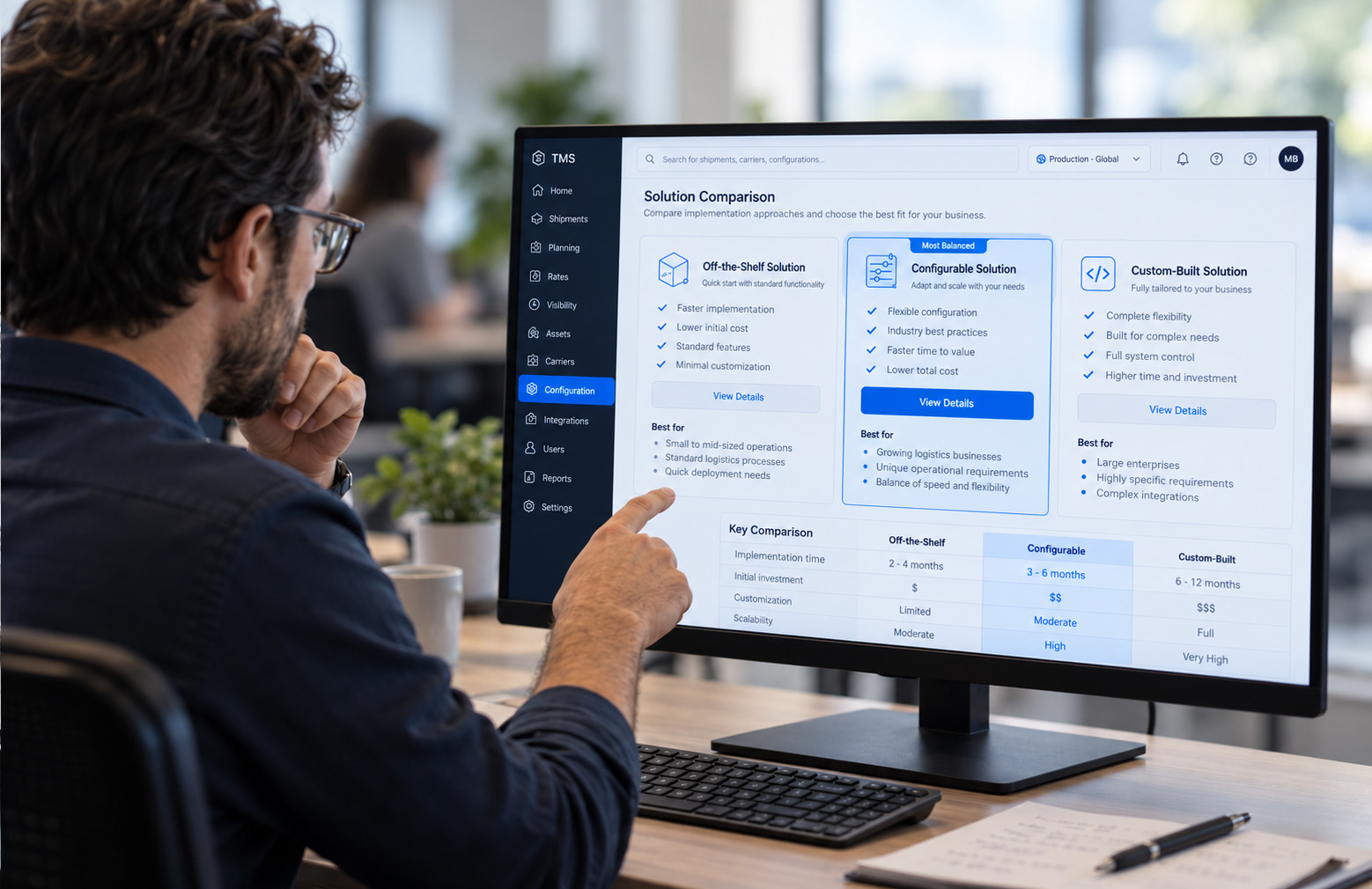 Person comparing off-the-shelf, configurable, and custom-built TMS solutions on a screen.