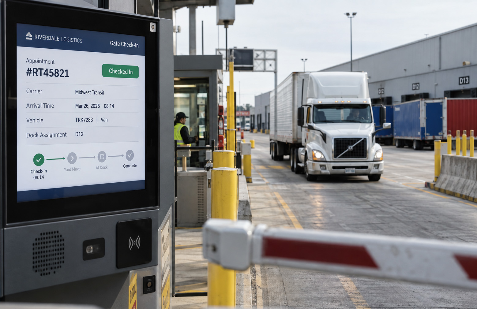 Truck arriving at a warehouse gate beside a digital check-in kiosk.