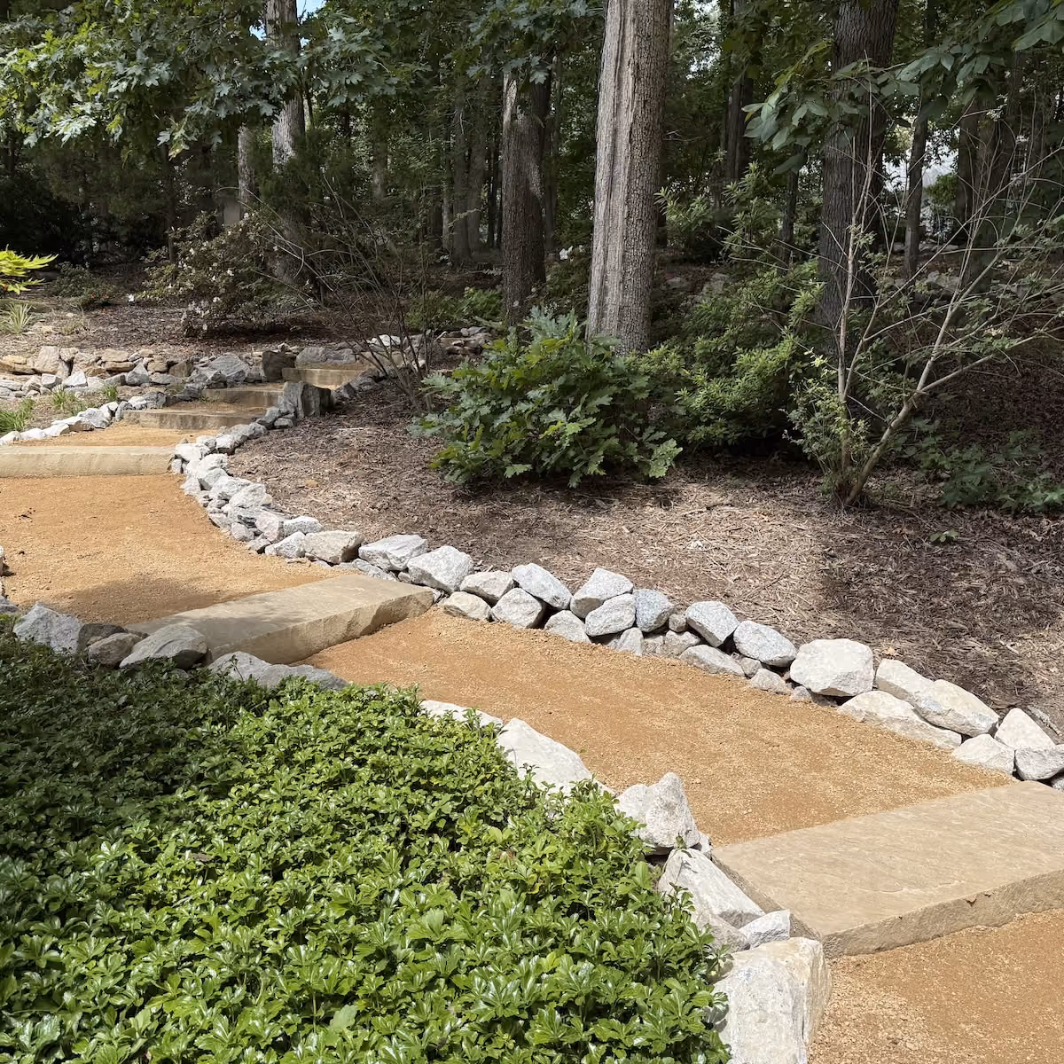 Professionally installed hardscape with natural stone and landscaping