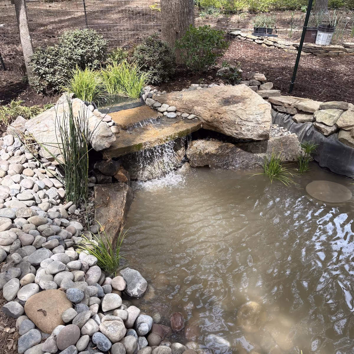 Custom pond and waterfall installation in Raleigh, North Carolina