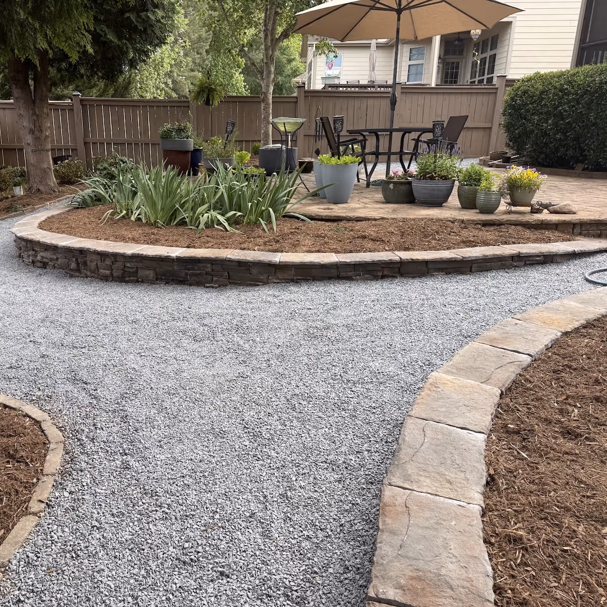 Stone retaining wall integrated into residential landscaping
