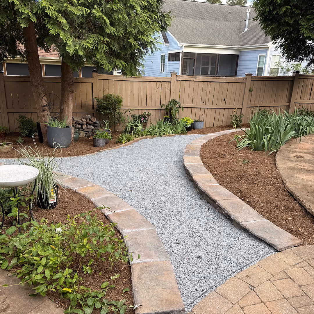 Custom block retaining wall creating usable landscape space