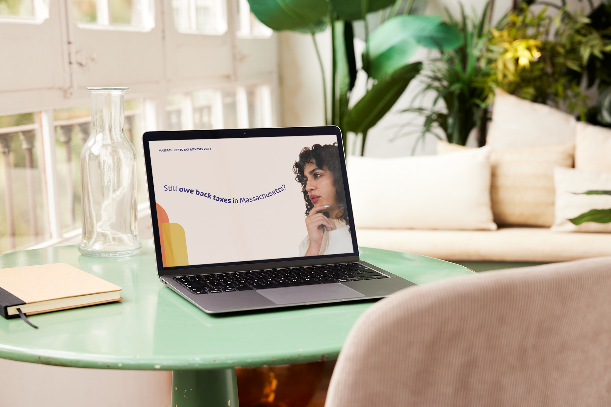 Laptop showing a Massachusetts Tax Amnesty ad that asks, Still owe back taxes in Massachusetts?