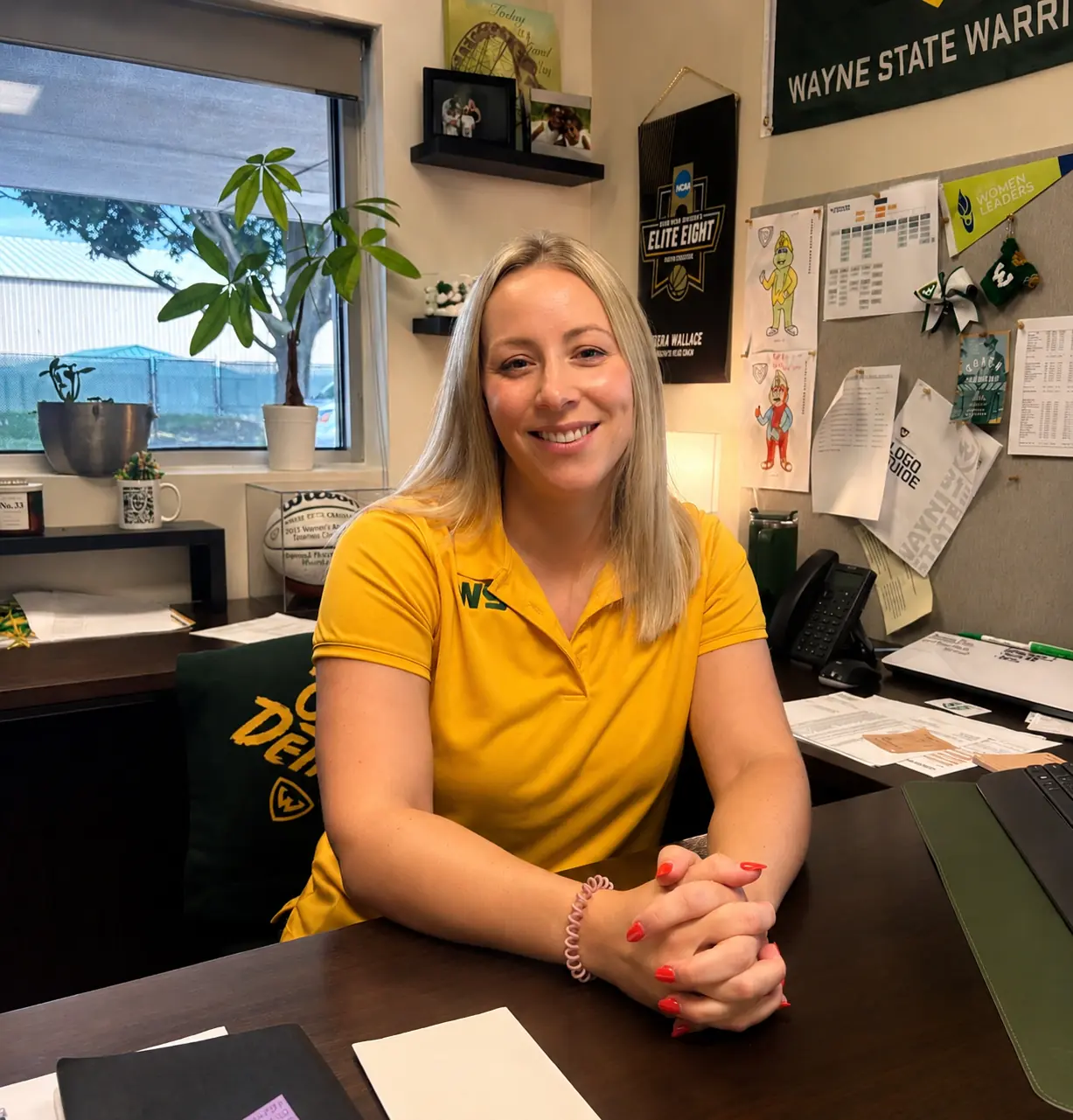 Erika Wallace, Wayne State University Director of Athletics, seated in her office.
