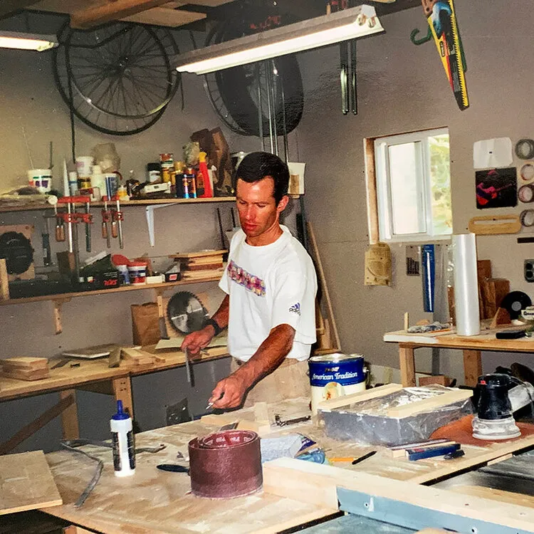 Old photo of a man working in a wood shop