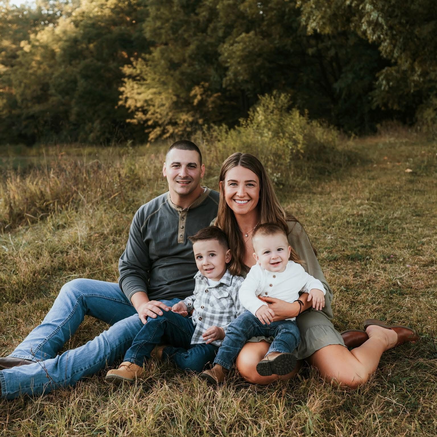 Nicole "Coco" Burke with her family at in a field