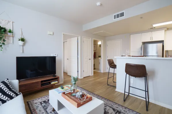 Living area with sofa, coffee table, and tv