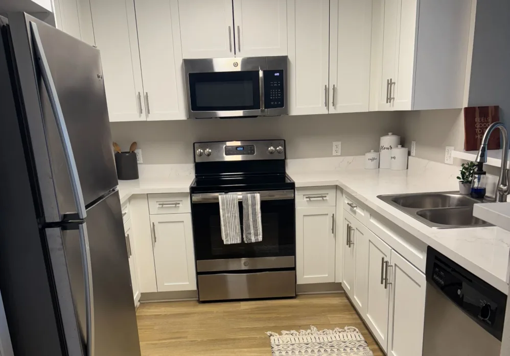 Kitchen with white cabinets and stainless steel appliances