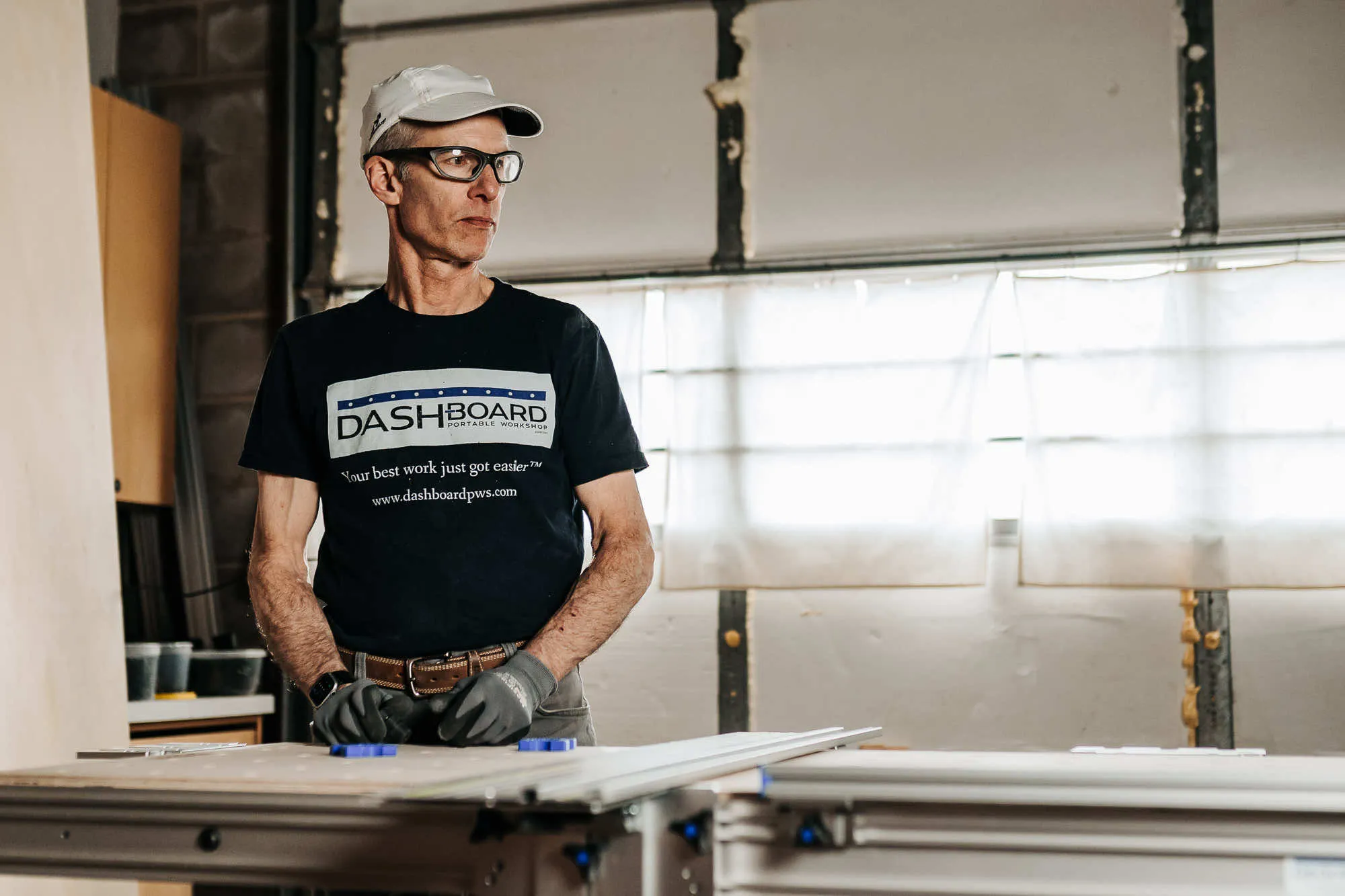 a man standing at a new workbench