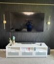 Standard wall-mounted television installation by A-Breasy