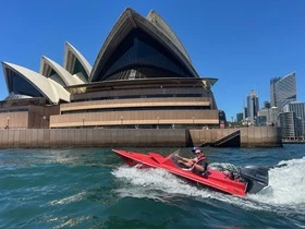 Speedboat flying past Sydney Opera House