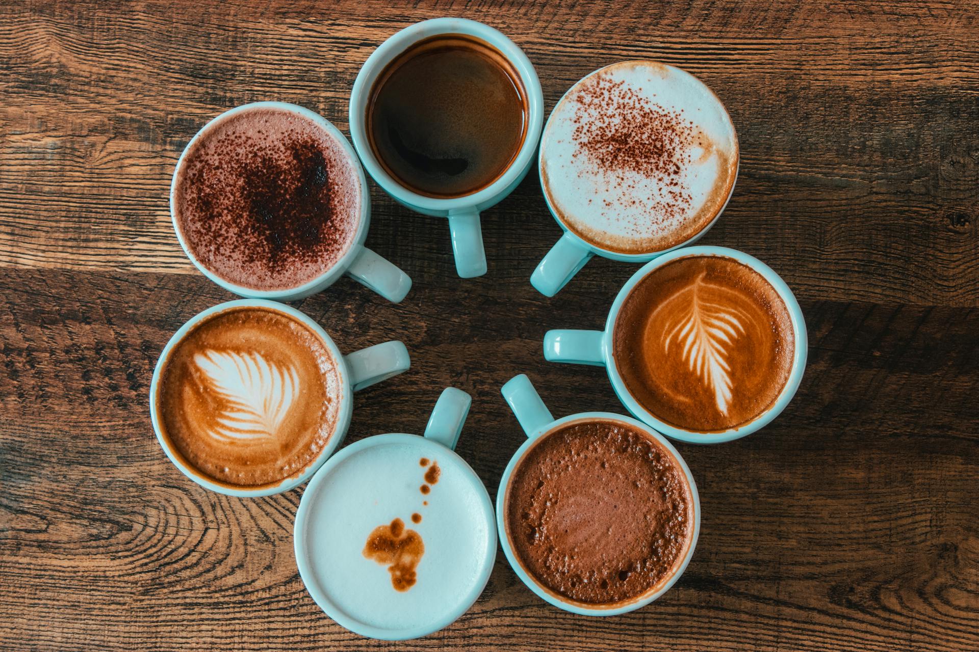 Coffee art in cups on table