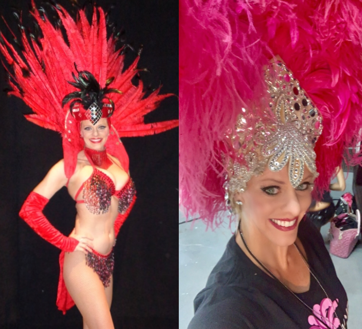 Dar Brzezinski smiling in elaborate red showgirl costumes with feathered headpieces and sequined details.
