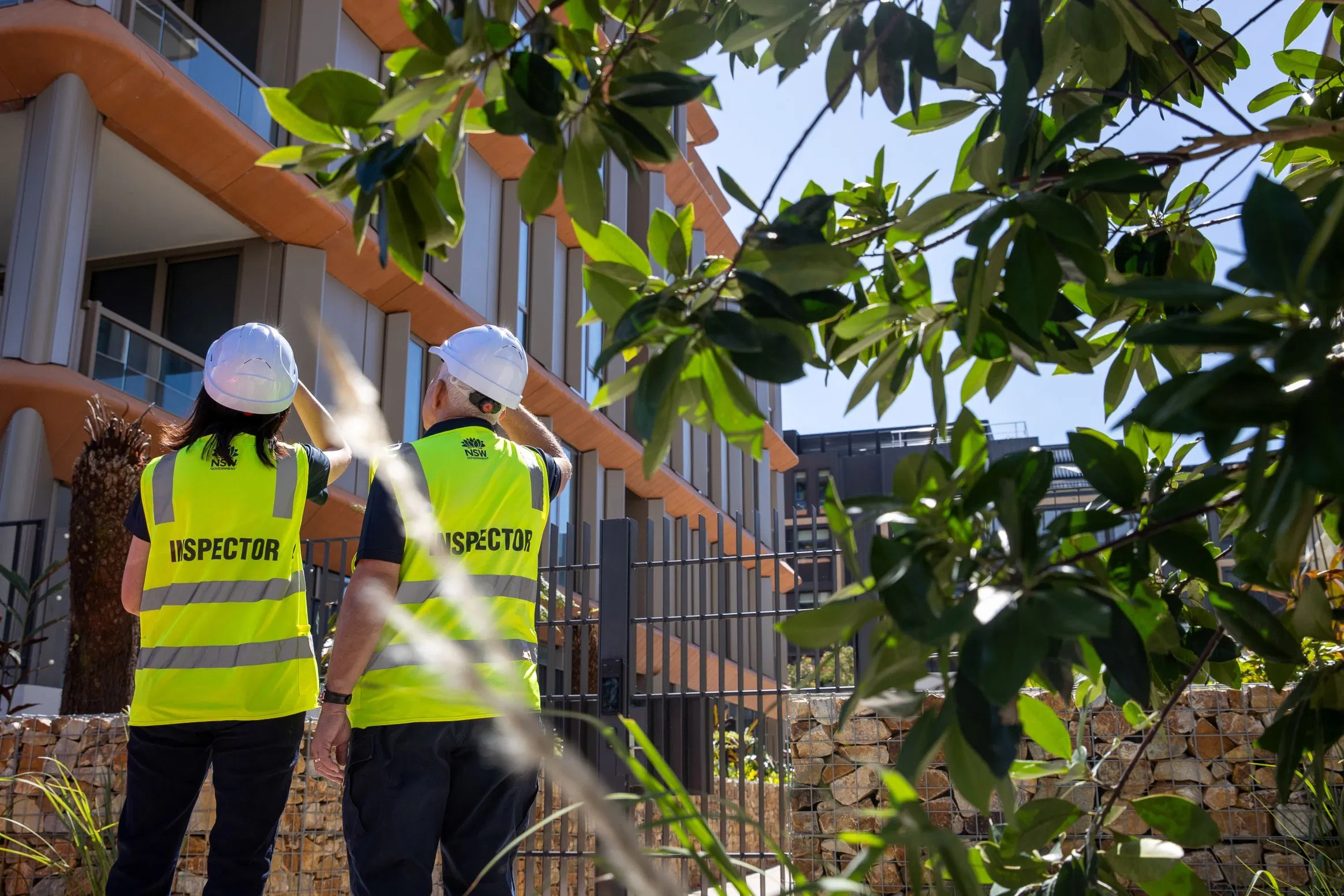 NSW building inspectors reviewing plans and site details during a residential compliance inspection.