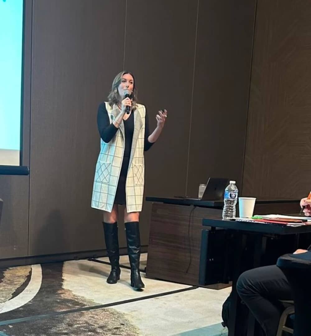 Brynne Speaking in Front of the Room - Photo