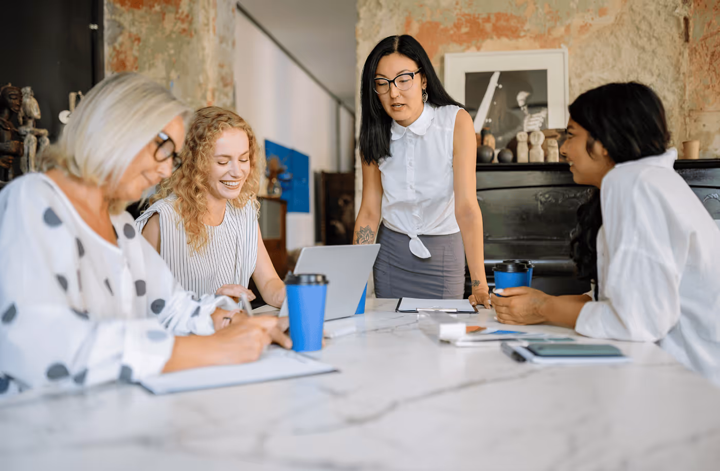 Four People Having a Team Meeting - Photo