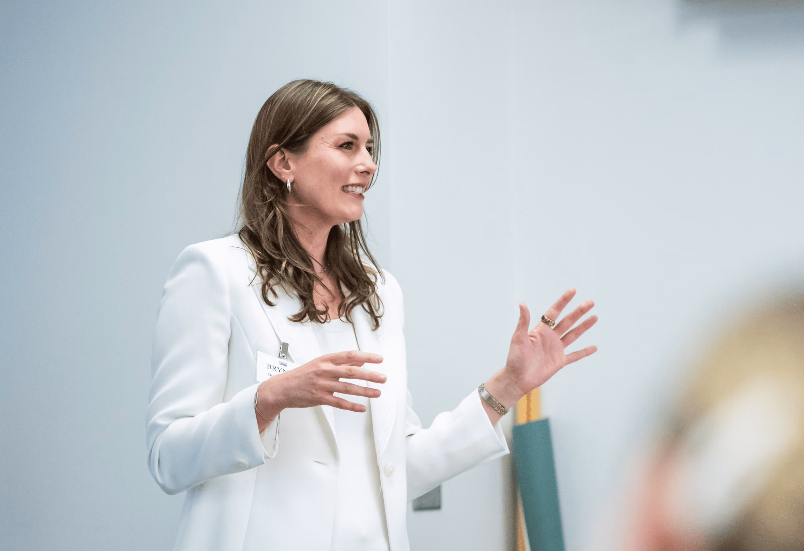Brynne Speaking on a Stage - Photo