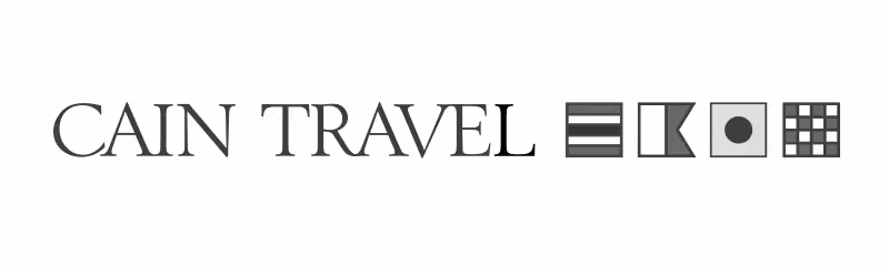 Text 'CAIN TRAVEL' followed by four distinct black and white geometric icons in a row.