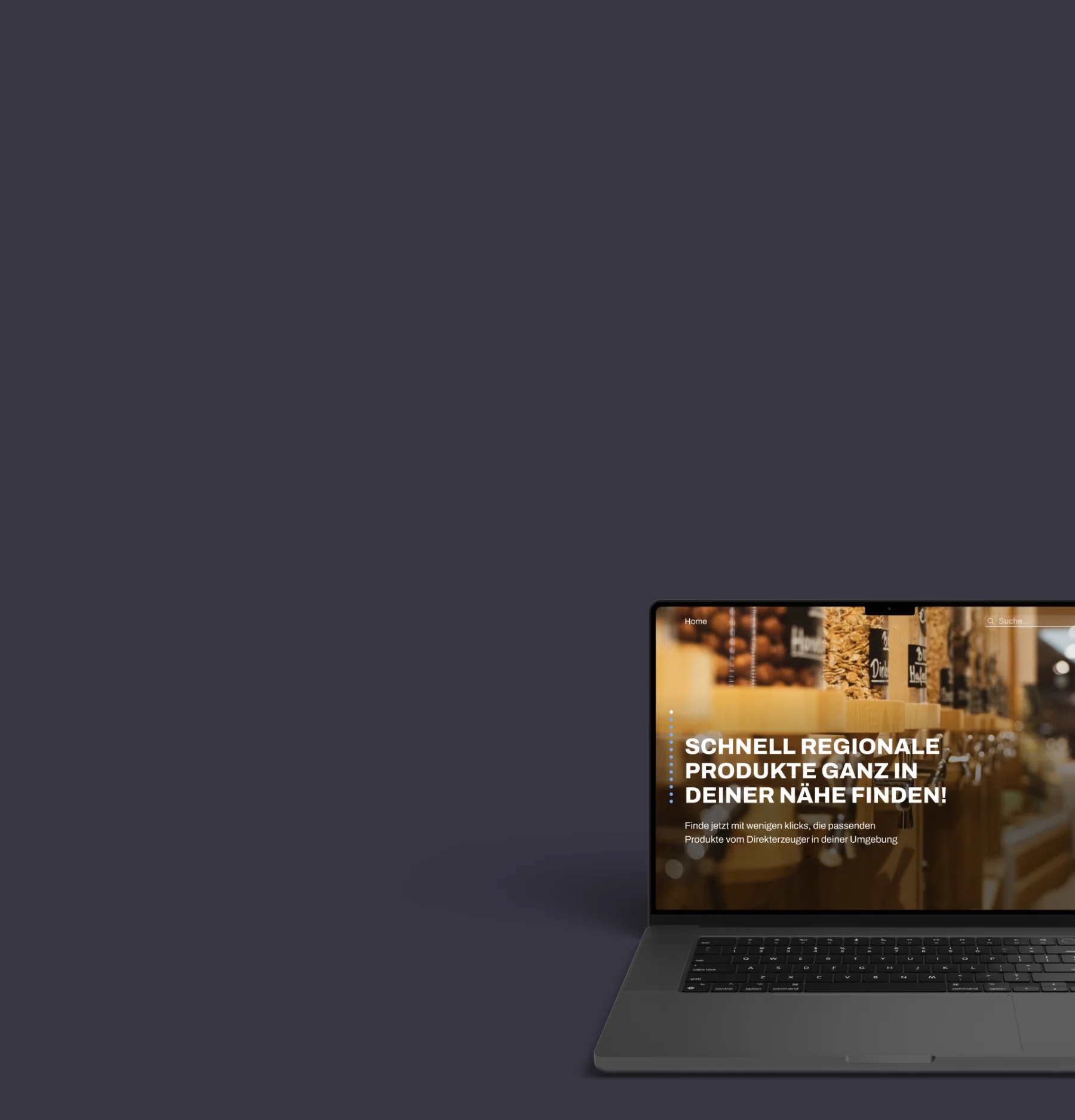 Laptop mit Website, die regionale Produkte sucht, vor dunklem Hintergrund.