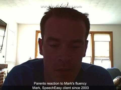 Man speaking in a well-lit room with windows, caption shows he is a SpeechEasy client since 2003.