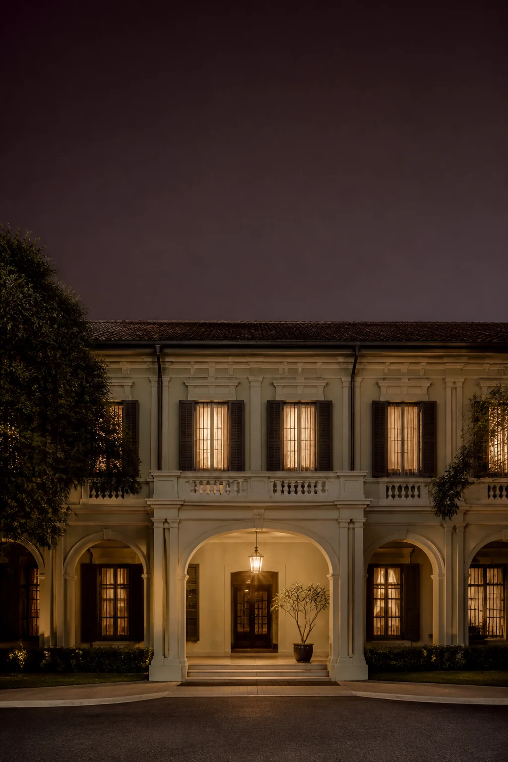 A heritage hotel with lime-plaster arches at dusk