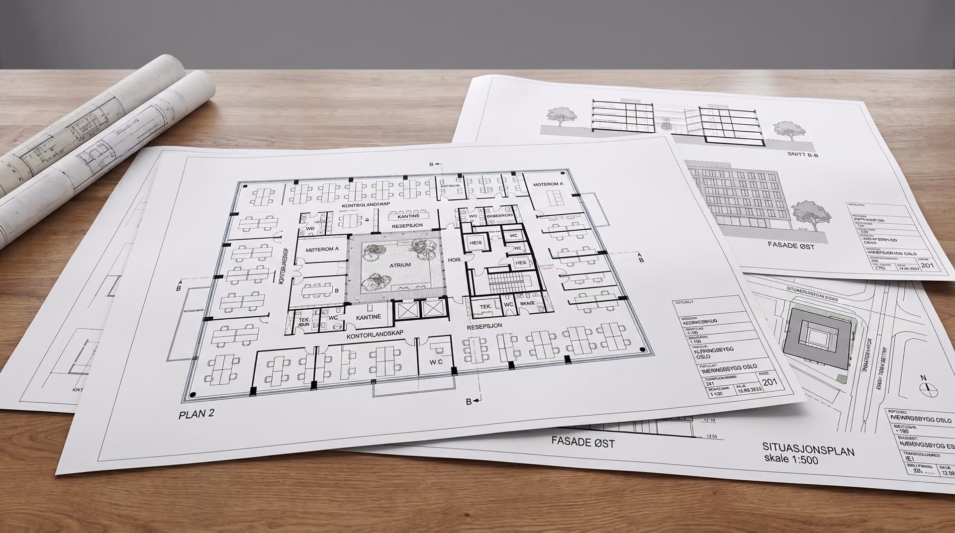 Architectural floor plans and building blueprints laid on a wooden table, showing office layouts.