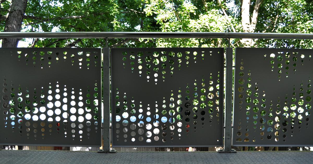 Perforated aluminium balustrade panels with top rail - Coetzenberg Stadium by TILT Screens