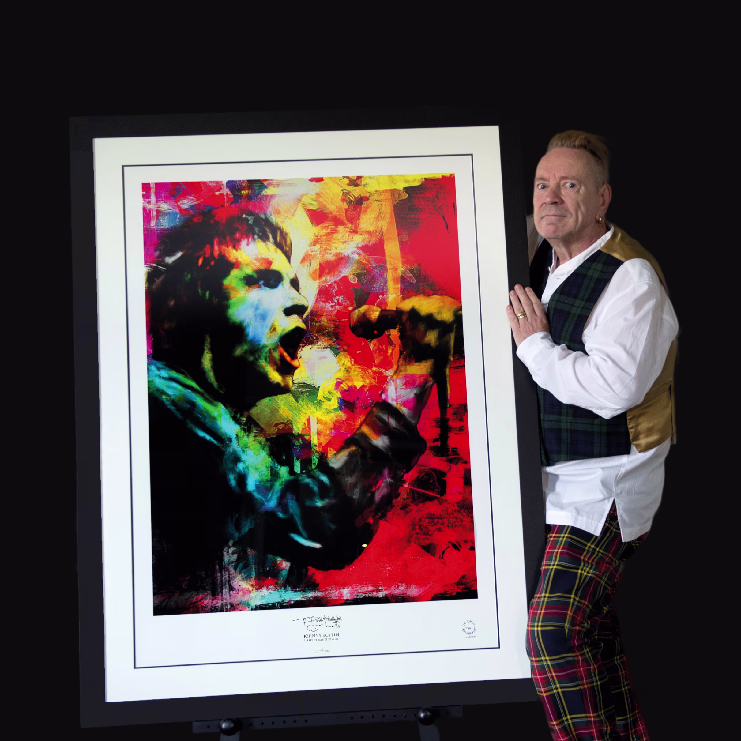 Johnny Rotten with his signed fine art limited edition colourful portrait print