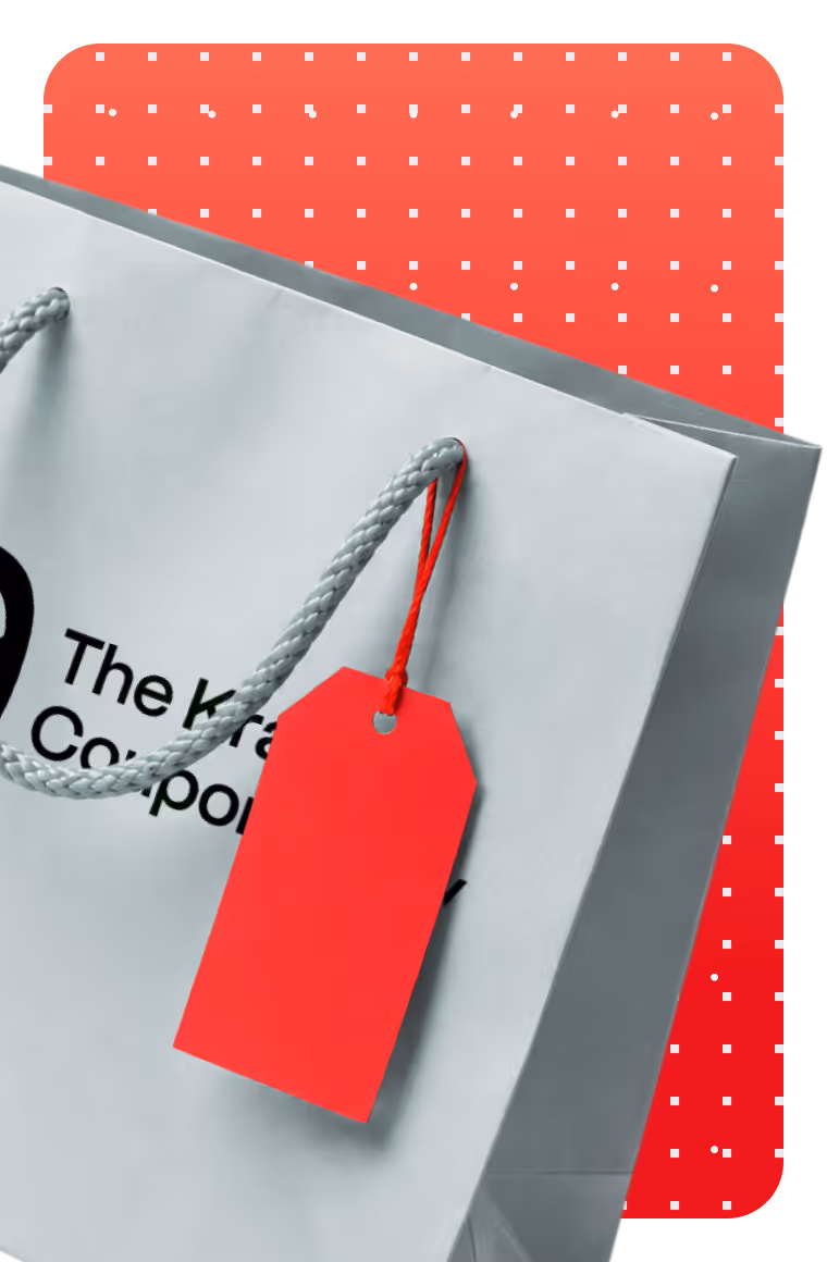 Close-up of a white shopping bag with grey handles and a red blank price tag attached.