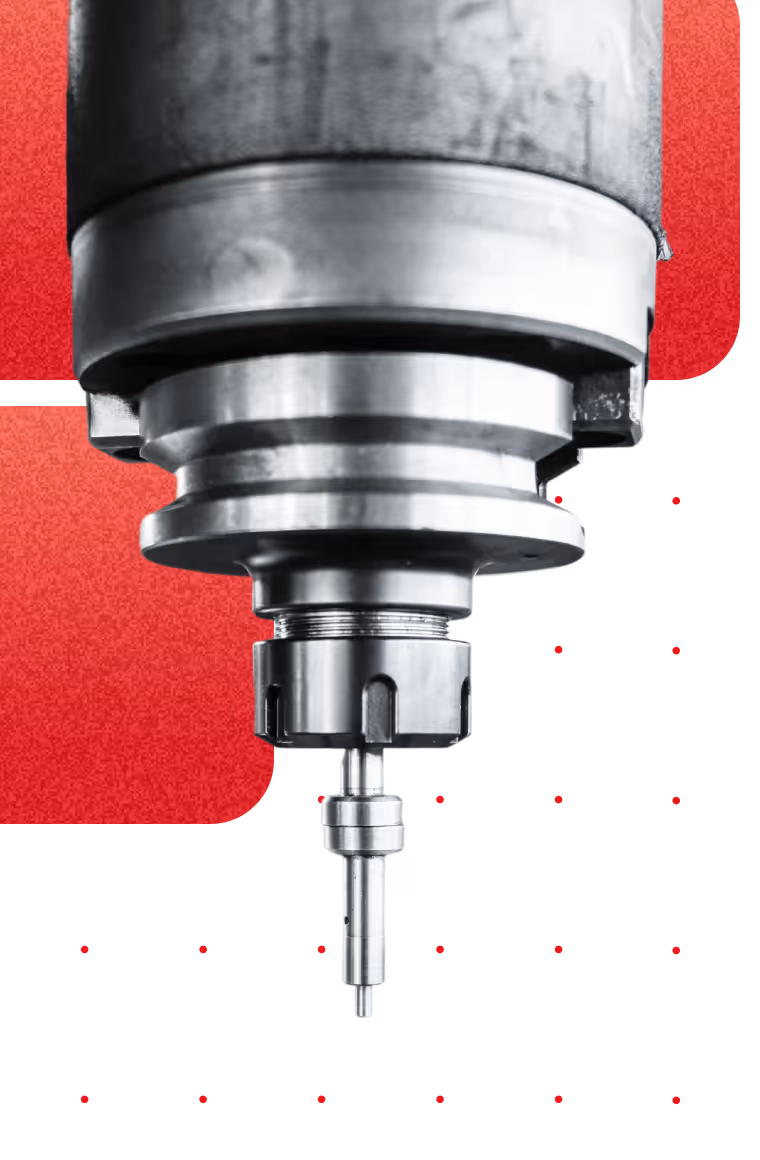 Close-up of a metal CNC machine tool spindle with a drill bit against a red and black background.
