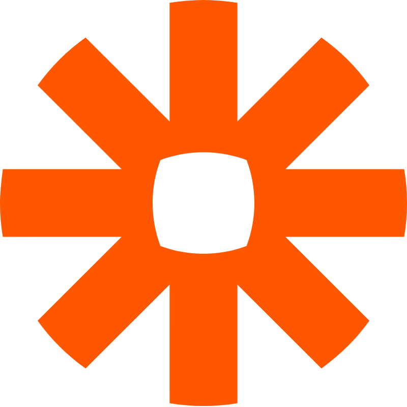 Orange cogwheel shape with eight thick spokes and a square center on black background.