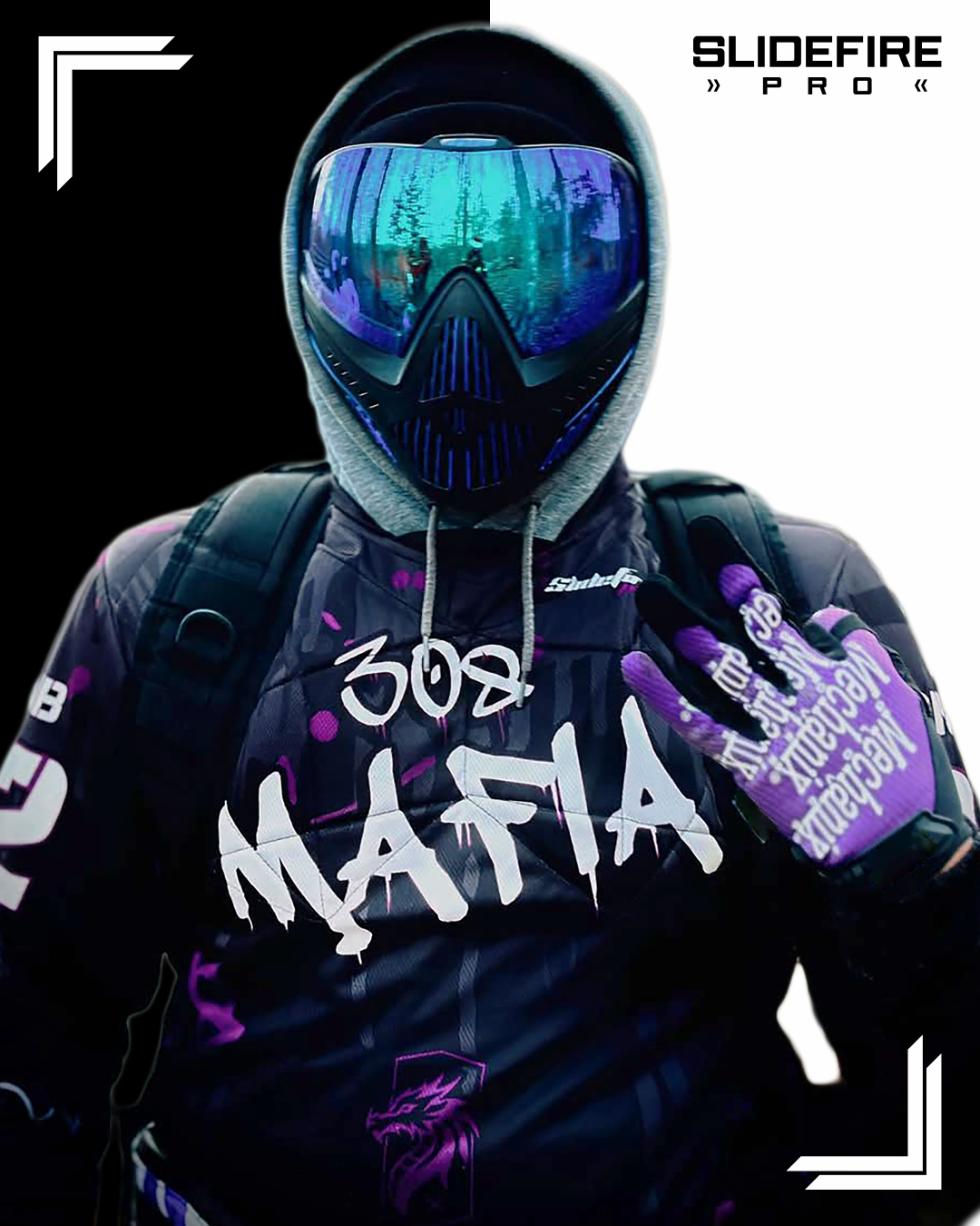 Competitive speedsoft player wearing custom purple and black SlideFirePro jersey with protective mask and tactical gear.