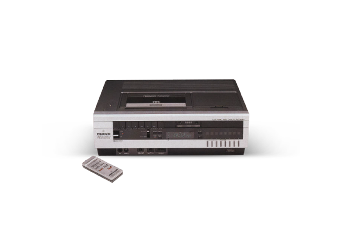 Vintage Ferguson Videostar VHS player with remote control on a white background.