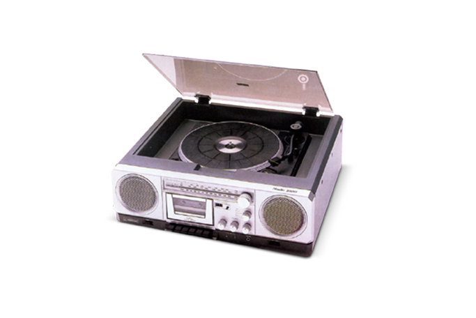 Vintage portable stereo with turntable, cassette player, radio tuner, and speakers.