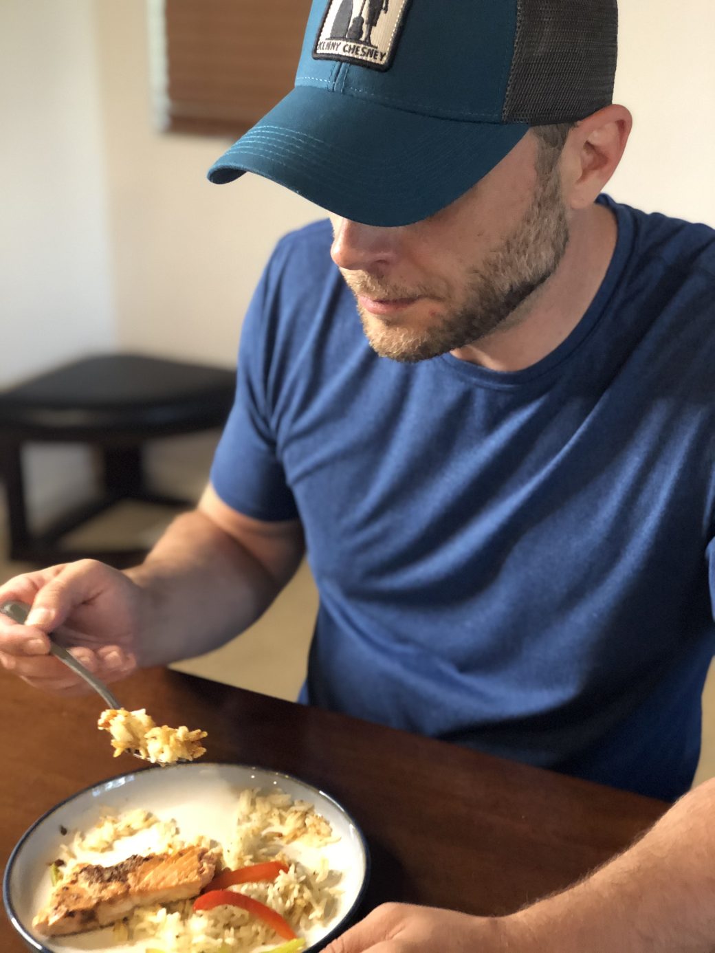 Corey eating a simple plate of salmon, rice, and veggies