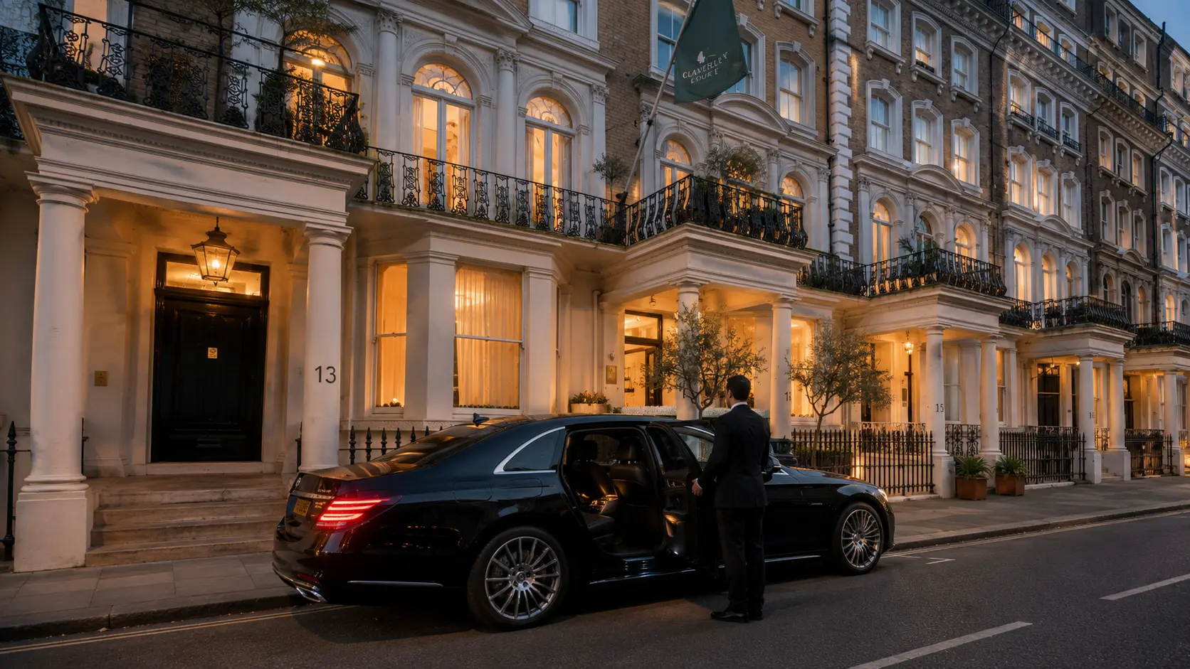 Chauffeur opening a luxury saloon outside Claverley Court in Knightsbridge at dusk