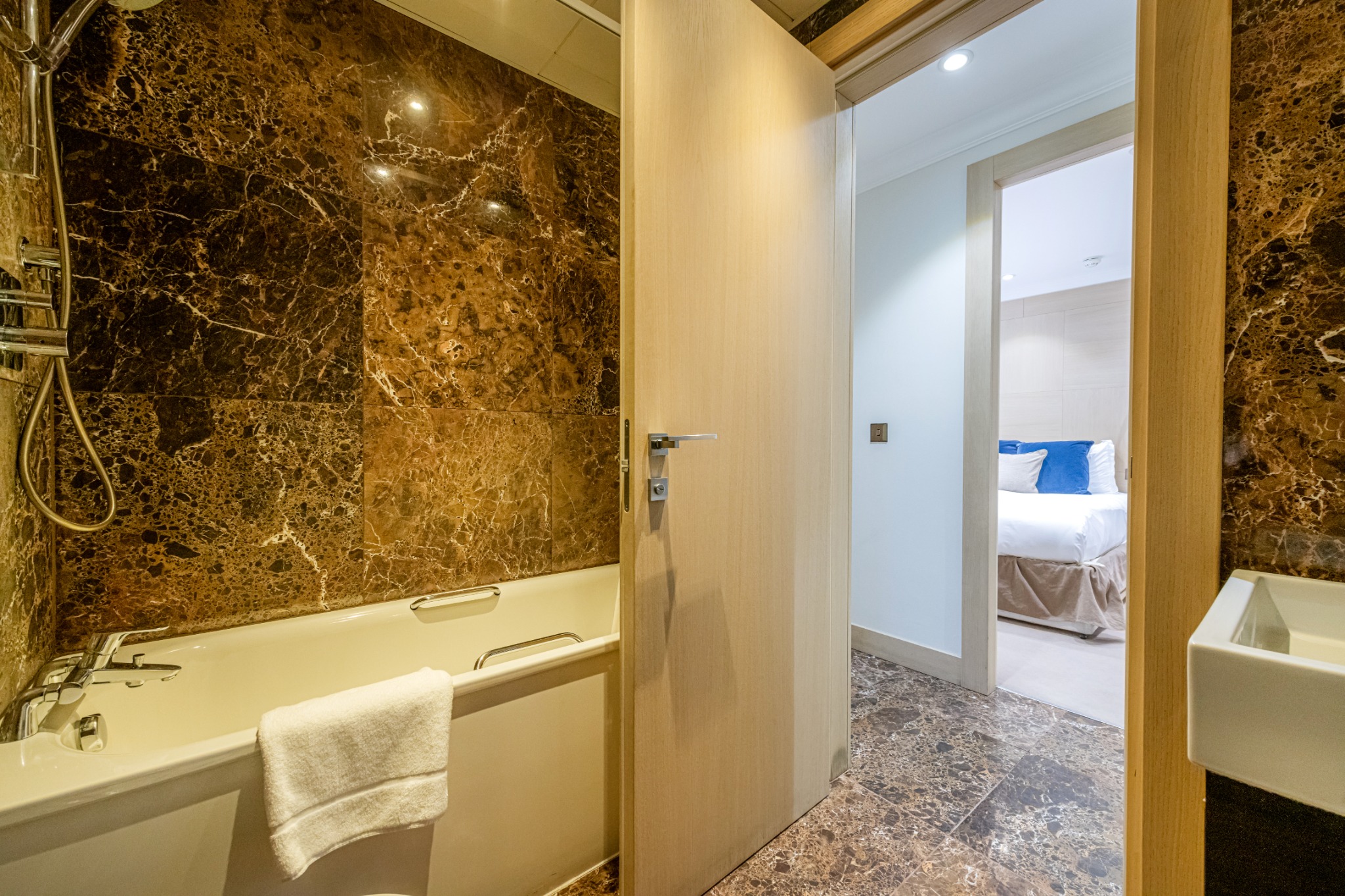 Bathroom with bath in the Two Bedroom Executive apartment at Claverley Court
