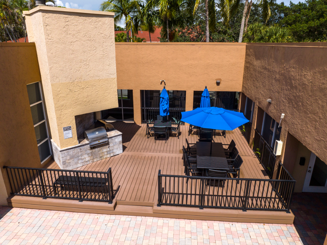 Bbq and picnic area with grill and table with umbrella