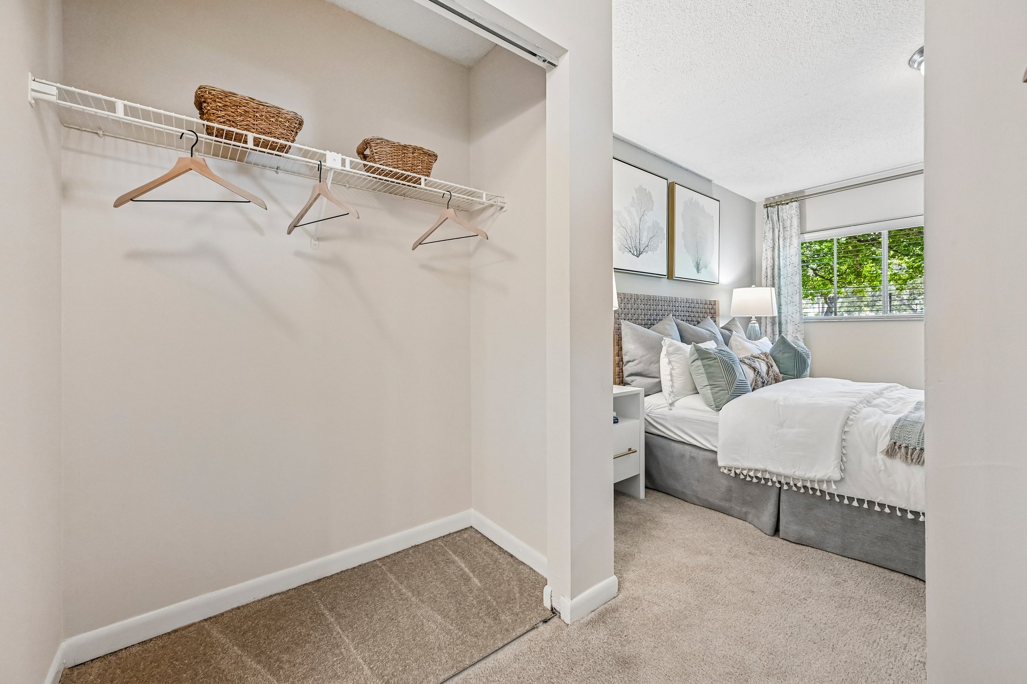 Walk in closet with view of bedroom through the door Azalea Village